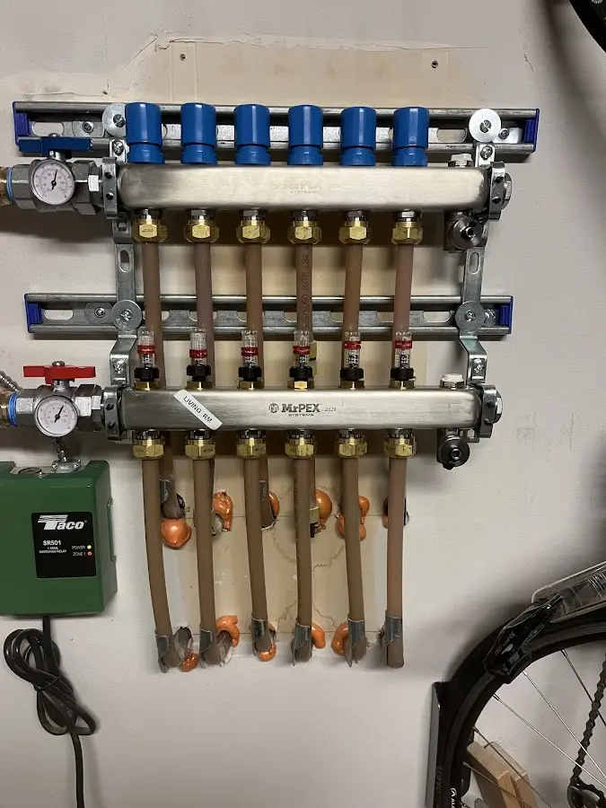 Plumber performing Water Heater Repair at a residential property in Milaca